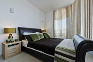 Luxury,Modern,Bedroom,With,A,Leather,Coated,Bed,Frame,Bedside