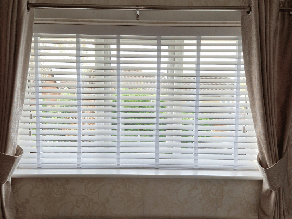 Faux wood venetian blinds fitted in a common area