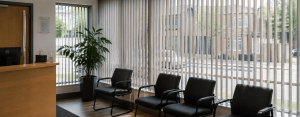 Commercial vertical blinds fitted in a customer waiting area