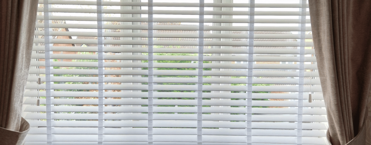 Faux wood venetian blinds fitted in a common area