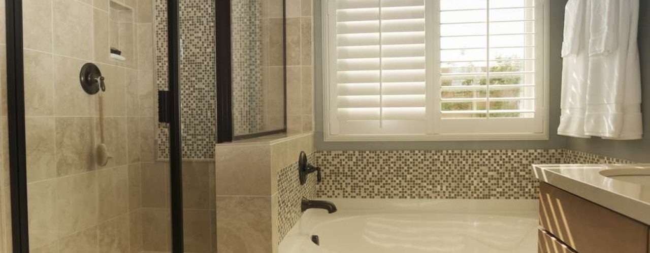 A pair of shutters set up in a bathroom, showing the quality look of bathroom shutters.