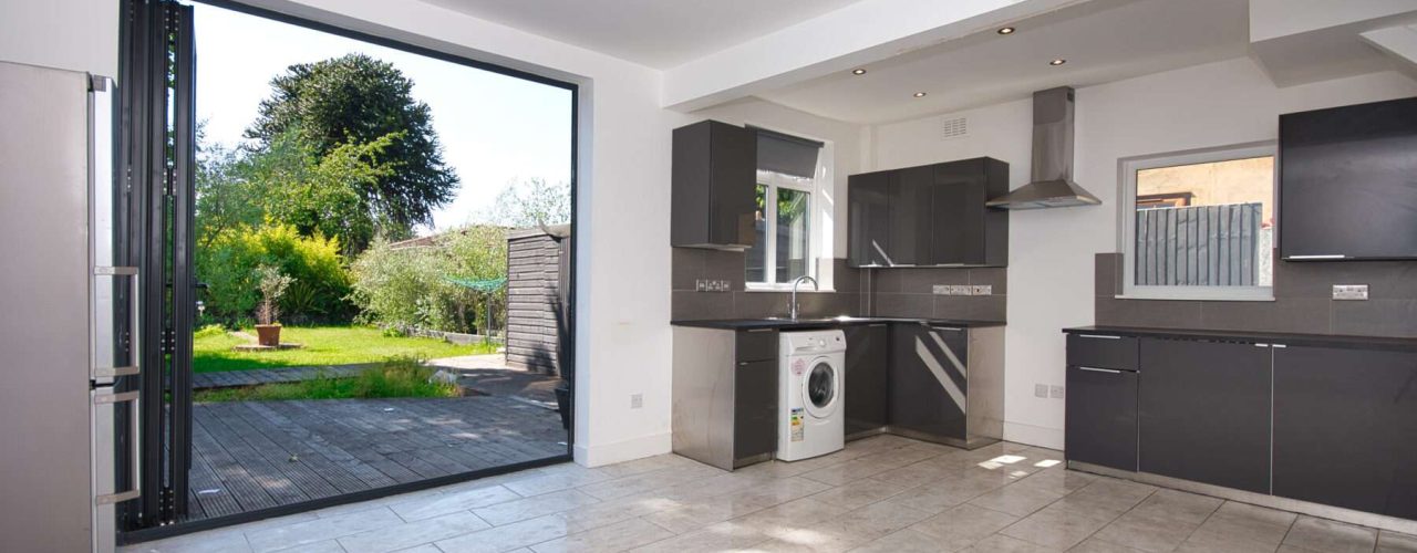 Bifold doors in a kitchen area overlooking the garden.