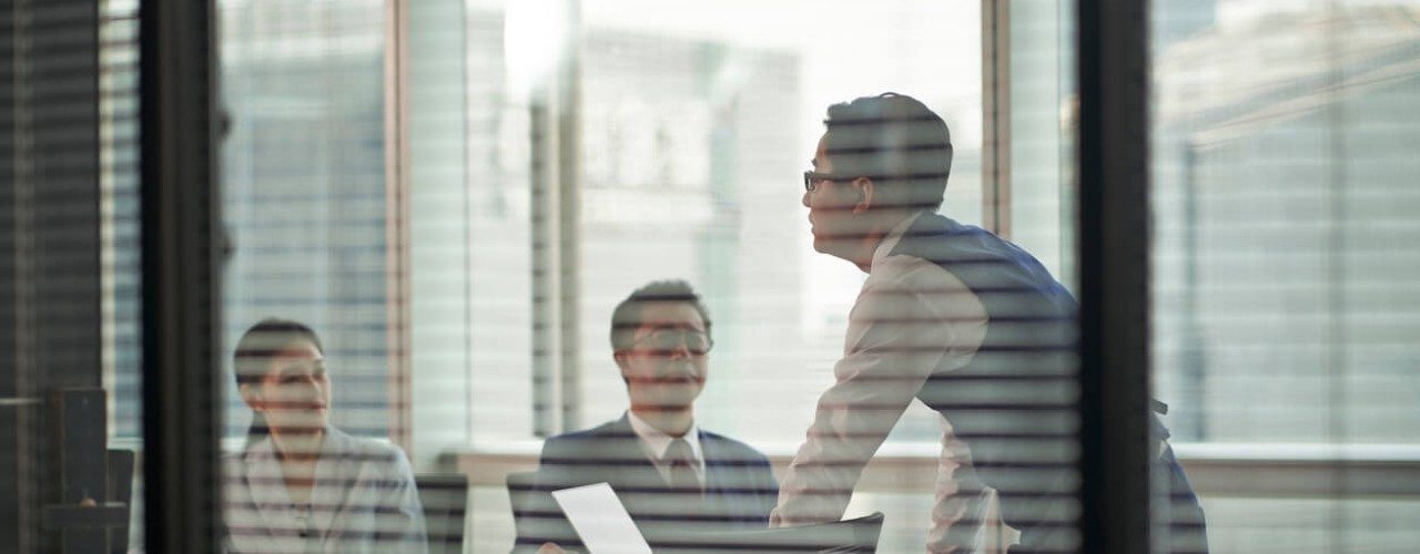 Office blinds matter for energy efficiency because they create a physical thermal barrier against solar radiation at the window level.