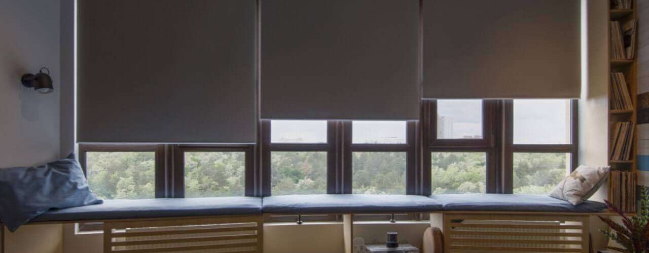 Motorised blinds closing on a window